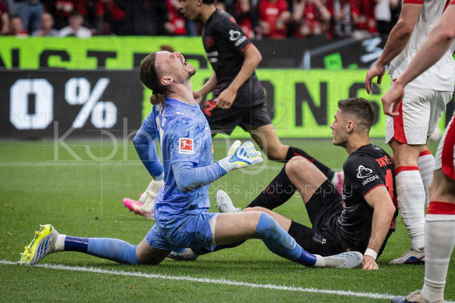 German Bundesliga, Bayer 04 Leverkusen vs. RB Leipzig, 02.05.2026 | LEVERKUSEN, GERMANY - MAY 2, 2026 :  Keeper Maarten Vandevoordt(RB Leipzig, 26) tackled by Patrik Schick (Bayer 04 Leverkusen, 14) during the German Bundesliga match on gameday 32 between Bayer 04 Leverkusen vs. RB Leipzig at BayArena on May 2, 2026 in Leverkusen, Germany. DFL REGULATIONS PROHIBIT ANY USE OF PHOTOGRAPHS AS IMAGE SEQUENCES AND/OR QUASI-VIDEO.