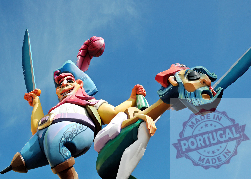 Colorful fallas festival pirate ninots against blue sky. Fallas Fiestas Communidad Valenciana | Large pirate ninots appearing against a bright blue sky at the Fallas festival in Valencia - Realized with Pictrs.com