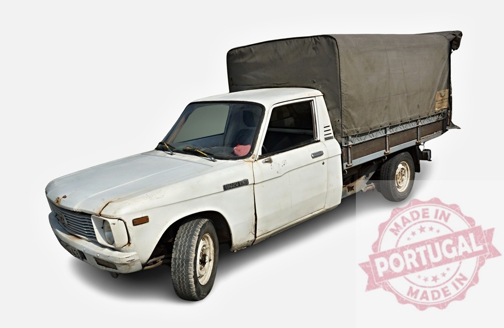 Old white Isuzu KB pickup truck transporting goods is parked on a white background | Classic Isuzu KB pickup truck with cargo bed covered by canvas parked on white background - Realized with Pictrs.com