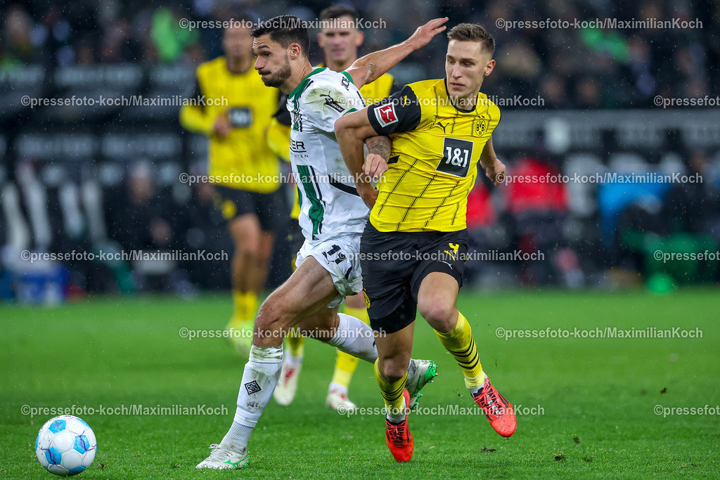 BMG07122401106 | 07.12.2024, Fußball, Borussia Mönchengladbach - Borussia Dortmund, 1. Fußball Bundesliga, Borussia-Park, Saison 2024 2025: xxxxxxxxxxxxx im zweikampf gegen Nico Schlotterbeck (BVB #4)DFB regulations prohibit any use of photographs as image sequences and or quasi-video.