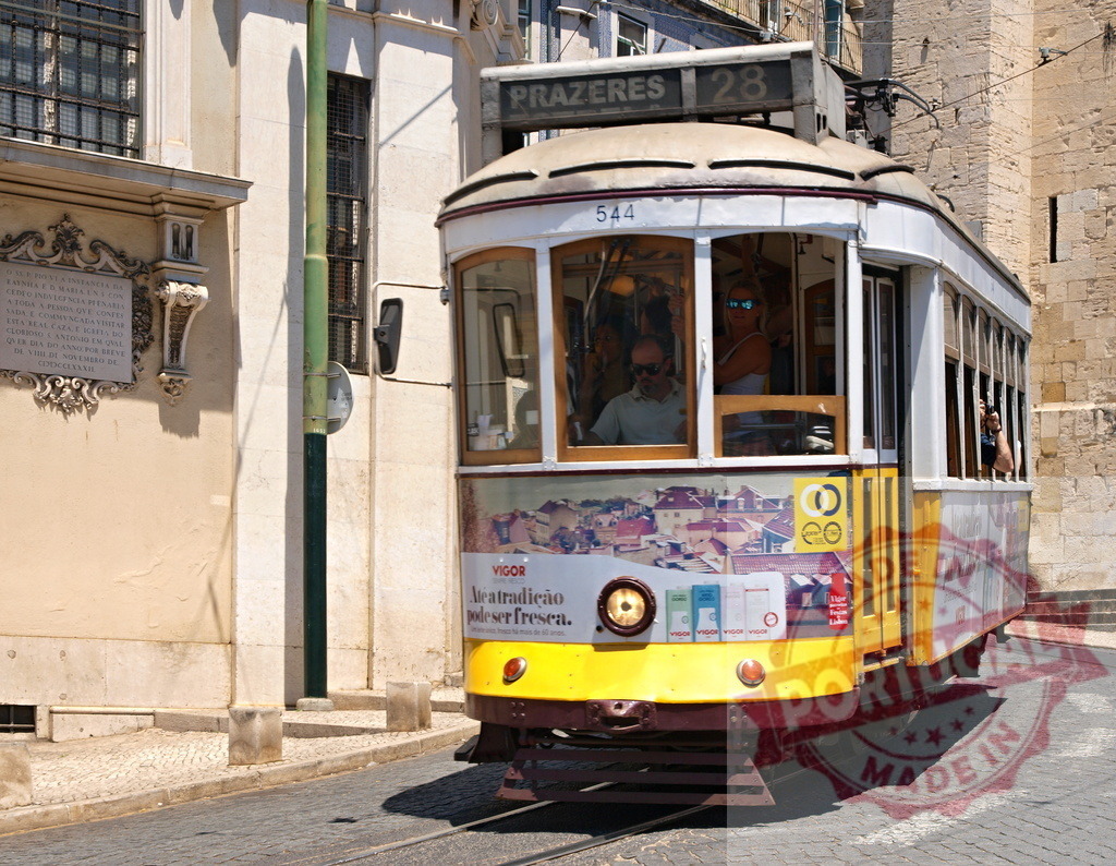 Yellow Tram Number 28 Driving on Lisbon Street in Portugal | Yellow tram number 28 driving on Lisbon street in Portugal, carrying tourists and locals - Realisiert mit Pictrs.com