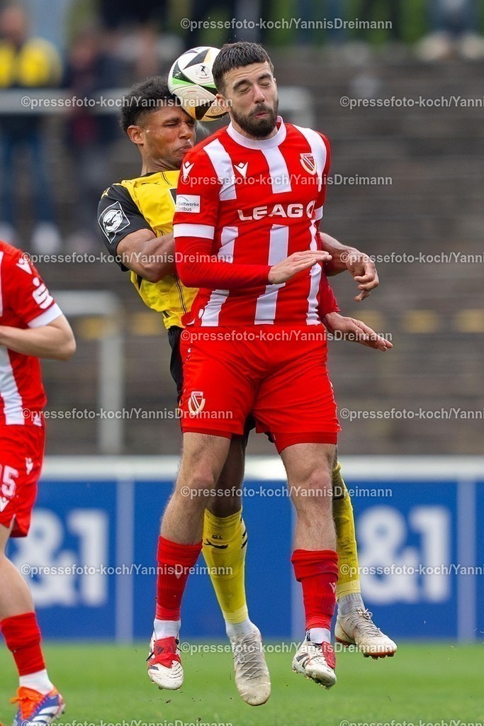 xydr13042501080 | 13.04.2025, xydrx, Fußball, Borussia Dortmund II - FC Energie Cottbus, 3.Liga, Stadion Rote Erde, Saison 2024 2025: Paul-Philipp Besong (Borussia Dortmund II #7) im Kopfball Duell gegen Dominik Pelvian (FC Energie Cottbus #5) DFB regulations prohibit any use of photographs as image sequences and or quasi-video.