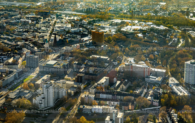 Gelsenkirchen231104319 | Luftbild, City Altstadt Einkaufsstraßen, Ebertstraße mit Grünstreifen und Fritz-Rahkob-Platz, Hans-Sachs-Haus und City Hochhaus Weißer Riese, Evangelisches Klinikum Gelsenkirchen Krankenhaus, Heinrich-König-Platz mit Altstadtkirche und Probsteikirche St. Augustinus, rechts Evangelisches Klinikum Gelsenkirchen Krankenhaus, Targobank gelbes Hochhaus, umgeben von herbstlichen Laubbäumen, Stadtmitte, Gelsenkirchen, Ruhrgebiet, Nordrhein-Westfalen, Deutschland