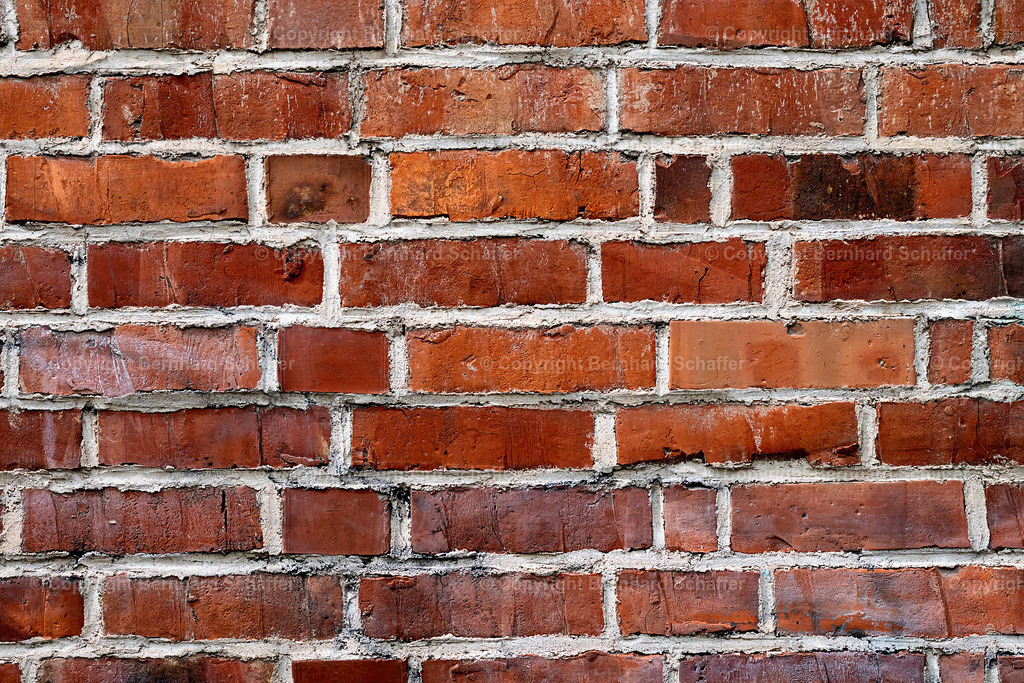 Ziegelmauerwand | Eine Mauer aus roten Ziegelsteinen. - Realisiert mit Pictrs.com