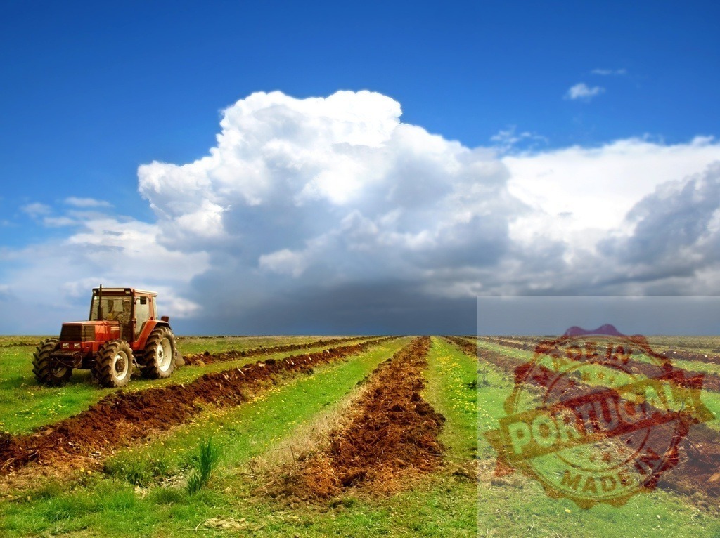 Tractor plowing field under dramatic sky agriculture | Tractor preparing soil for planting crops on a farm landscape - Realized with Pictrs.com