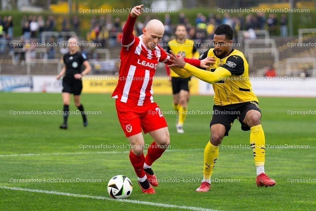 xydr13042501048 | 13.04.2025, xydrx, Fußball, Borussia Dortmund II - FC Energie Cottbus, 3.Liga, Stadion Rote Erde, Saison 2024 2025: Maximilian Krauß (FC Energie Cottbus #23) im Zweikampf gegen Almugera Kabar (Borussia Dortmund II #42) DFB regulations prohibit any use of photographs as image sequences and or quasi-video.