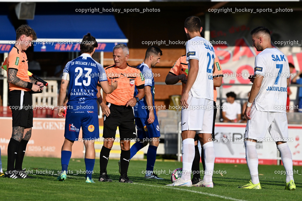 SAK vs. SV Dellach Gail | Marcel Andre Vaschauner Referee, #23 Maximilian Wastian SV Dellach Gail, Karl Stark Referee, #22 Leo Ejup SAK, #7 Hrvoje Jakovljevic SAK, #10 Samir Nuhanovic SV Dellach Gail, SAK vs. SV Dellach Gail, SAK vs. SV Dellach Gail am 14.08.2025 in Klagenfurt (Sportpark Welzenegg), Austria, (Photo by Bernd Stefan)