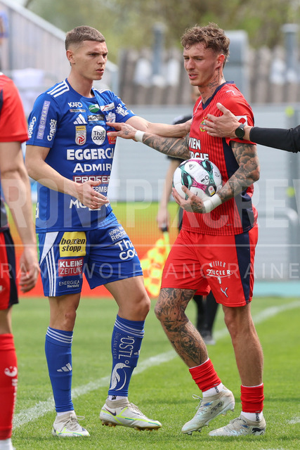 TSV Egger Glas Hartberg vs SK Rapid Wien – Championship Group    | Hartberg, Austria, 19.Apr.26 - SOCCER - ADMIRAL Bundesliga, TSV Egger Glas Hartberg vs SK Rapid Wien. The image shows Elias Havel (Hartberg) and Bendeguz Bolla (SK Rapid Wien). 