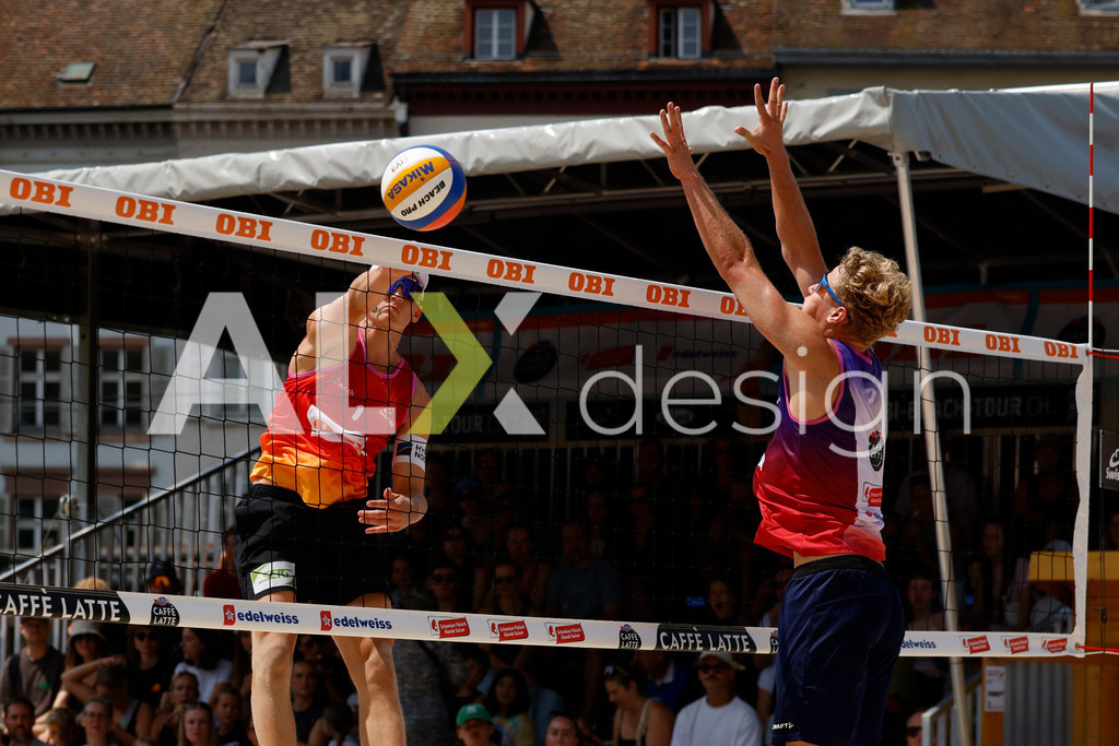 Obi BeachTour 2026 - Basel | BASEL, SWITZERLAND - JULY 19: LAURENZ LEITNER (AUT) attack / spike against MATHIS KÄLIN (SUI) block during the Obi BeachTour 2026 match between LEITNER / KINDL (AUT) and BREER / KÄLIN (SUI) at Barfüsserplatz on July 19, 2026 in Basel, Switzerland. - Realisiert mit Pictrs.com