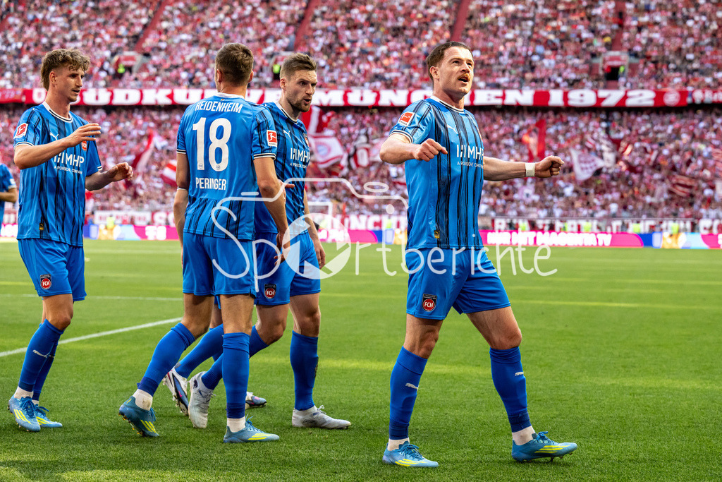 FC Bayern München - 1. FC Heidenheim | MUNICH, GERMANY - 02. MAI: Jubel der Gäste nach dem Treffer zum 0-1 durch Budu ZIVZIVADZE (1. FC Heidenheim 11) während dem Bundesligamatch zwischen dem FC Bayern München und dem 1. FC Heidenheim am 32. Spieltag in der Allianz Arena / DFL REGULATIONS PROHIBIT ANY USE OF PHOTOGRAPHS AS IMAGE SEQUENCES AND/OR QUASI-VIDEO