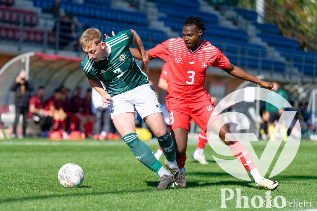 UEFA Region's Cup - NI Western Region v Vaud | Niall Fielding (3 NI Western Region) and Stephane Goncalves Gomes (3 Vaud) battle for the ball (duel) during the UEFA Region's Cup game between NI Western Region and Vaud at Centre Sportif de Colovray in Nyon, Switzerland 