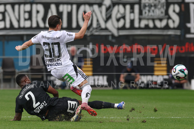 SK Puntigamer Sturm Graz vs TSV Egger Glas Hartberg – Championship Group    | Graz, Austria, 12.Apr.26 - SOCCER - ADMIRAL Bundesliga, SK Puntigamer Sturm Graz vs TSV Egger Glas Hartberg. The image shows Jeyland Mitchell (STU) and Lukas Fridrikas (Hartberg).    