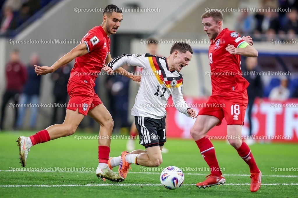 DFB14112501066 | 14.11.2025, Fußball, Länderspiel, WM-Qualifikation Europa, Deutschland - Luxemburg, Stade de Luxembourg (Croix de Gasperich, Luxemburg), 9. Spieltag, Saison 2025 2026: Florian Wirtz (GER #17) geht im Zweikampf gegen  Dirk Carlson (LUX #13)  und Laurent Jans (LUX #18) im Strafraum zu BodenRegulations prohibit any use of photographs as image sequences and or quasi-video.