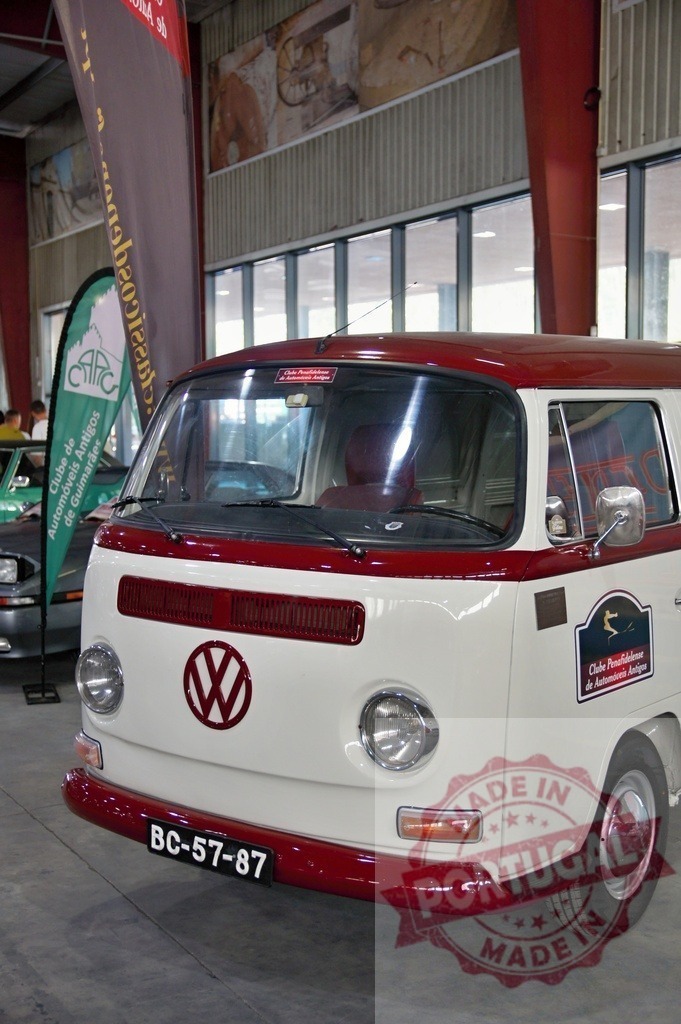 Classic Volkswagen Kombi Van parked in exhibition center | Restored Volkswagen Type 2 showing in an indoor exhibition center - Realized with Pictrs.com
