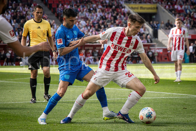 German Bundesliga,  1. FC Koeln - Bayer 04 Leverkusen, 25.04.2026 | KOELN, GERMANY - APRIL 25, 2026 :  Exequiel Palacios (Bayer 04 Leverkusen, 25), Kristoffer Lund (1. FC Koeln, 32) during the German Bundesliga match on gameday 31 between 1. FC Koeln - Bayer 04 Leverkusen at RheinEnergieSTADION on April 25, 2026 in Koeln, Germany. DFL REGULATIONS PROHIBIT ANY USE OF PHOTOGRAPHS AS IMAGE SEQUENCES AND/OR QUASI-VIDEO.