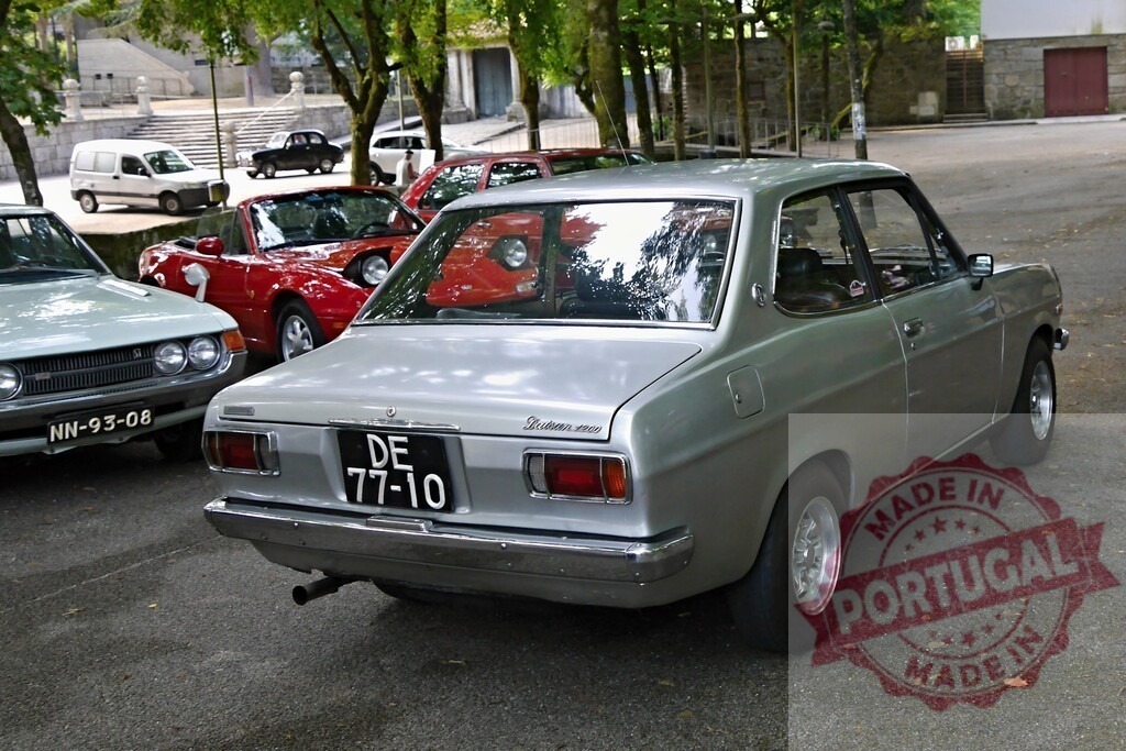 Datsun 1200 classic car parked at a car show | Datsun 1200 vintage car parked outdoors, showcasing classic automotive design and heritage - Realized with Pictrs.com