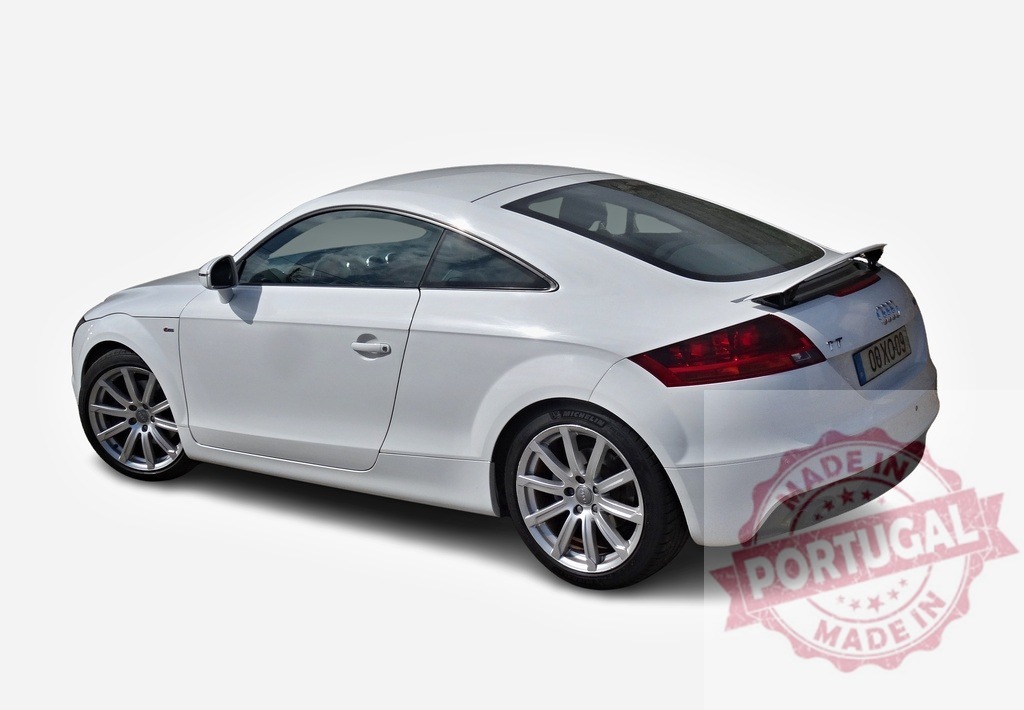 White Audi TT sports car parked on white background | Modern white Audi TT sports car parked on a white background, showcasing its sleek design - Realized with Pictrs.com