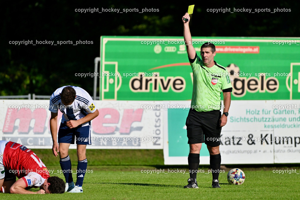 ATUS Nötsch vs. FC Dölsach | #21 Nicolas Francis Janschitz ATUS Nötsch, #12 Christian Brandstätter FC Dölsach, Peter Heiss Referee, Gelbe Karte, ATUS Nötsch vs. FC Dölsach, ATUS Nötsch vs. FC Dölsach am 23.08.2026 in Nötsch (Sportplatz Nötsch), Austria, (Photo by Bernd Stefan)