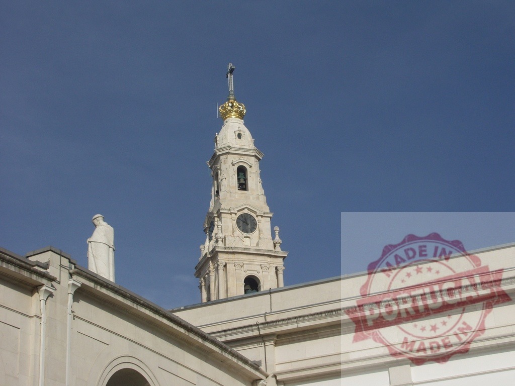 Sanctuary of Fatima basilica with statue and blue sky in Portugal | White marble Sanctuary of Fatima basilica with statue and blue sky, a major Catholic pilgrimage destination in Ourém, Portugal - Realized with Pictrs.com