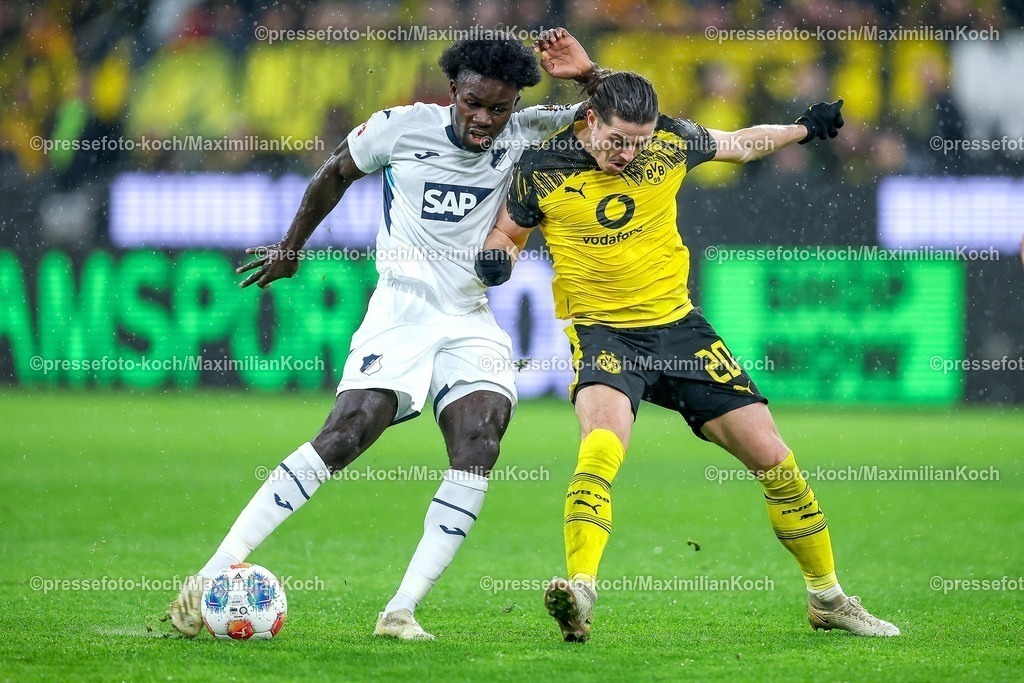 BVB07122501088 | 07.12.2025, Fußball, Borussia Dortmund - TSG 1899 Hoffenheimt, 1. Fußball Bundesliga, 13. Spieltag, Signal Iduna Park, Saison 2025 2026: Ihlas Bebou&nbsp;(TSG Hoffenheim #09) im Zweikampf gegen  Marcel Sabitzer&nbsp;(BVB #20)  DFB regulations prohibit any use of photographs as image sequences and or quasi-video.
