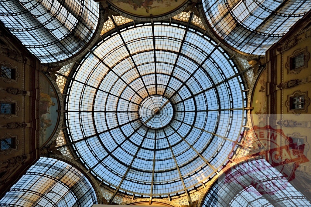 Galleria Vittorio Emanuele II glass dome ceiling showing architectural detail | Stunning view of the intricate glass and metalwork of the Galleria Vittorio Emanuele II's central dome in Milan, Italy - Realized with Pictrs.com