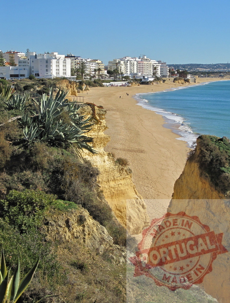Armação de Pêra beach cliffs coastline in Algarve Portugal. Algarve - Silves | Armação de Pêra beach with golden sand, blue ocean, coastal cliffs, and resort buildings - Realized with Pictrs.com