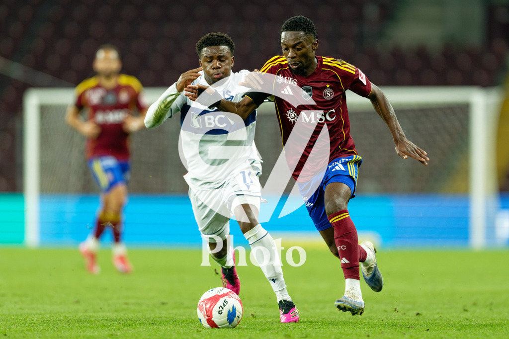 Brack Super League - Servette FC v FC Lausanne-Sport | Bradley Mazikou (18 Servette FC) in action (close up) under pressure of Nathan Butler-Oyedeji (11 FC Lausanne-Sport)  during the Brack Super League match between Servette FC and FC Lausanne-Sport at Stade de Geneve in Geneva, Switzerland