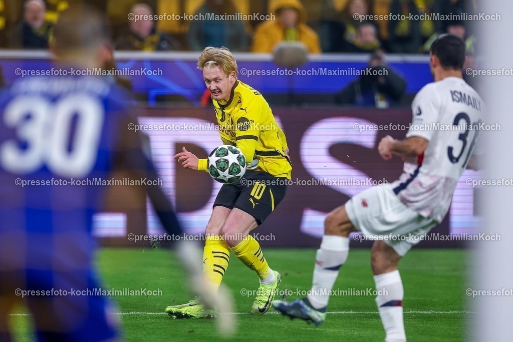 UCL04032501013 | 04.03.2025, Fußball, UEFA Champions League, Borussia Dortmund - OSC Lille, Signal Iduna Park, Runde der 16, Saison 2024 2025: Julian Brandt (BVB #10) im Zweikampf gegen Ismaily Goncalves dos Santos (LOSC Lille #31)
