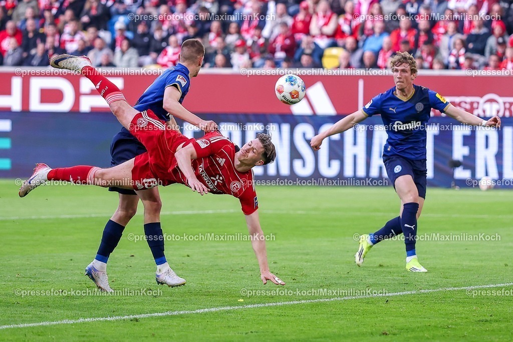 F9510042601032 | 10.04.2026, Fußball, Fortuna Düsseldorf - Holstein Kiel, 2. Fußball Bundesliga, Herren, Merkur Spiel-Arena, 29. Spieltag, Saison 2025 2026: Strafraumaktion Cedric Itten&nbsp;(Fortuna Düsseldorf #13) im Zweikampf gegen  Ivan Nekic&nbsp; (Holstein Kiel #13)  DFB regulations prohibit any use of photographs as image sequences and or quasi-video.