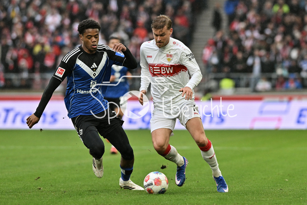 VfB Stuttgart - Hamburger SV | STUTTGART, GERMANY - 12. APRIL: tackle between Warmed OMARI (Hamburger SV 17) and Maximilian MITTELSTÄDT (VfB Stuttgart 7) during the Bundesliga Match between VfB Stuttgart vs. Hamburger SV on Matchday 29 at MHP Arena / DFL REGULATIONS PROHIBIT ANY USE OF PHOTOGRAPHS AS IMAGE SEQUENCES AND/OR QUASI-VIDEO