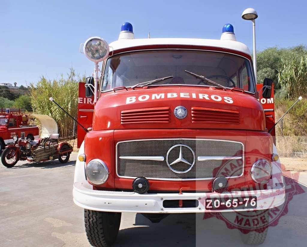 Vintage Bombeiros Mercedes-Benz fire truck in Portugal | Red vintage Mercedes-Benz fire truck with Bombeiros logo and blue lights parked outdoors - Realized with Pictrs.com