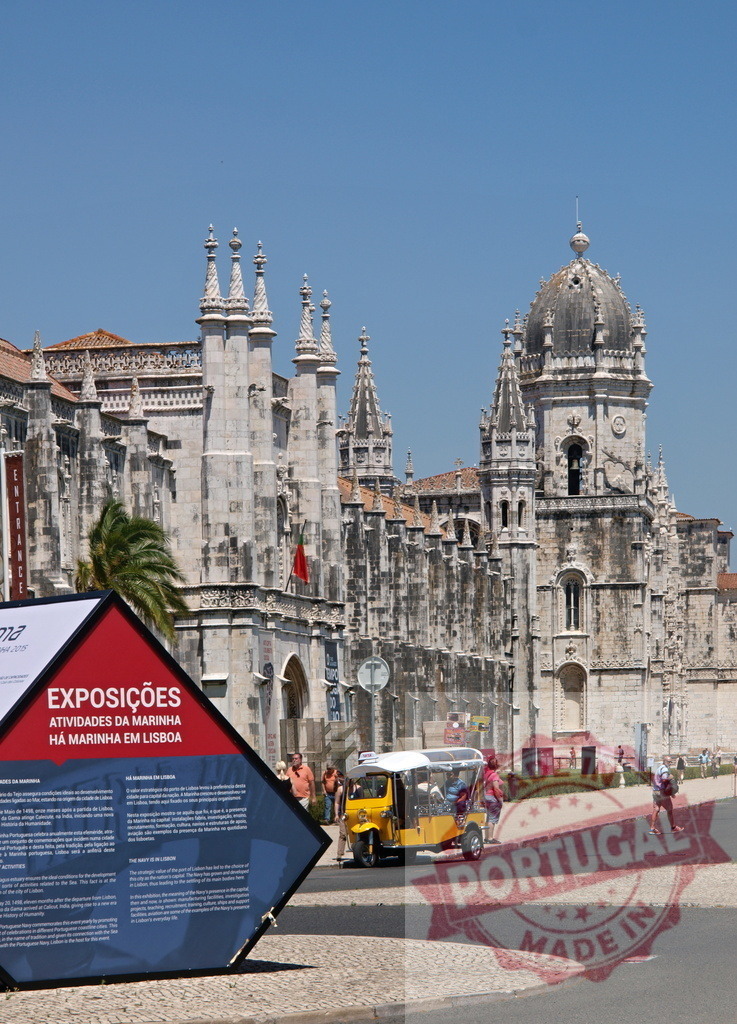 Jerónimos Monastery, Lisbon tourism with tuk-tuk vehicle. Lisbon - Portugal | Jerónimos Monastery architecture on a sunny day with a yellow tourist tuk-tuk and an exhibition sign - Realized with Pictrs.com