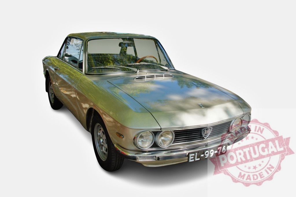Vintage Lancia Fulvia Sport 1.3s Coupe reflecting trees is parked | Classic metallic light green Lancia Fulvia Sport 1.3s Coupe reflecting trees parked on white background - Realized with Pictrs.com