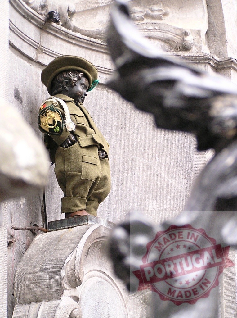 Manneken Pis wearing traditional military uniform in Brussels | Manneken Pis statue wearing a military uniform, a famous landmark in Brussels, Belgium - Realized with Pictrs.com