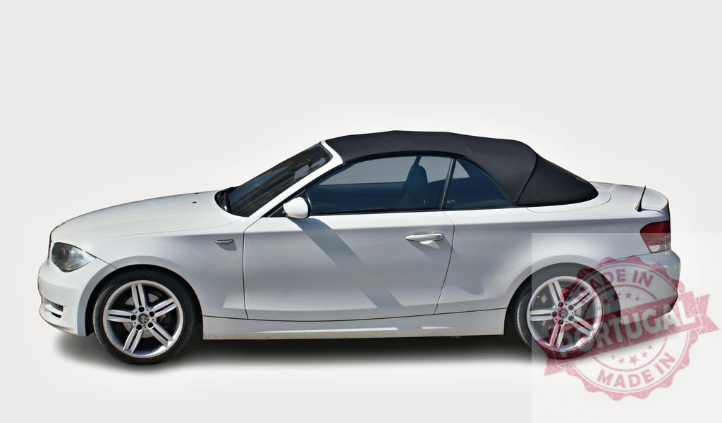 White BMW 1 series convertible parked on white background | Stylish white BMW 1 series convertible with black soft top parked on a white background, showcasing its elegant design - Realized with Pictrs.com