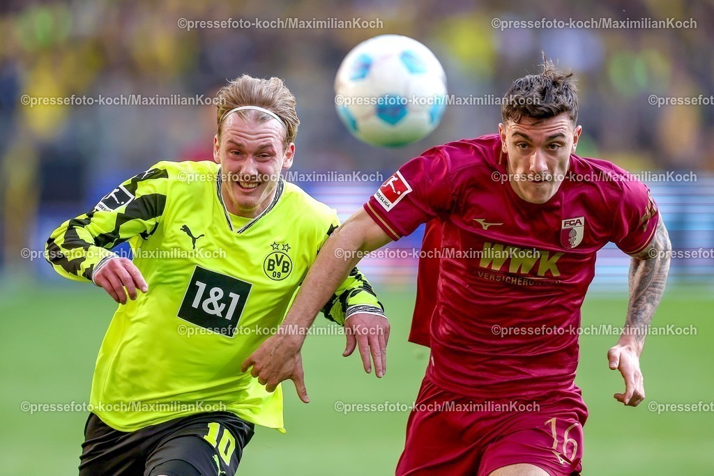 BVB08032501101 | 08.03.2025, Fußball, Borussia Dortmund - FC Augsburg, 1. Fußball Bundesliga, 25. Spieltag, Signal Iduna Park, Saison 2024 2025: Julian Brandt (BVB #10) im Zweikampf gegen Cedric Zesiger (FC Augsburg #16)DFB regulations prohibit any use of photographs as image sequences and or quasi-video.