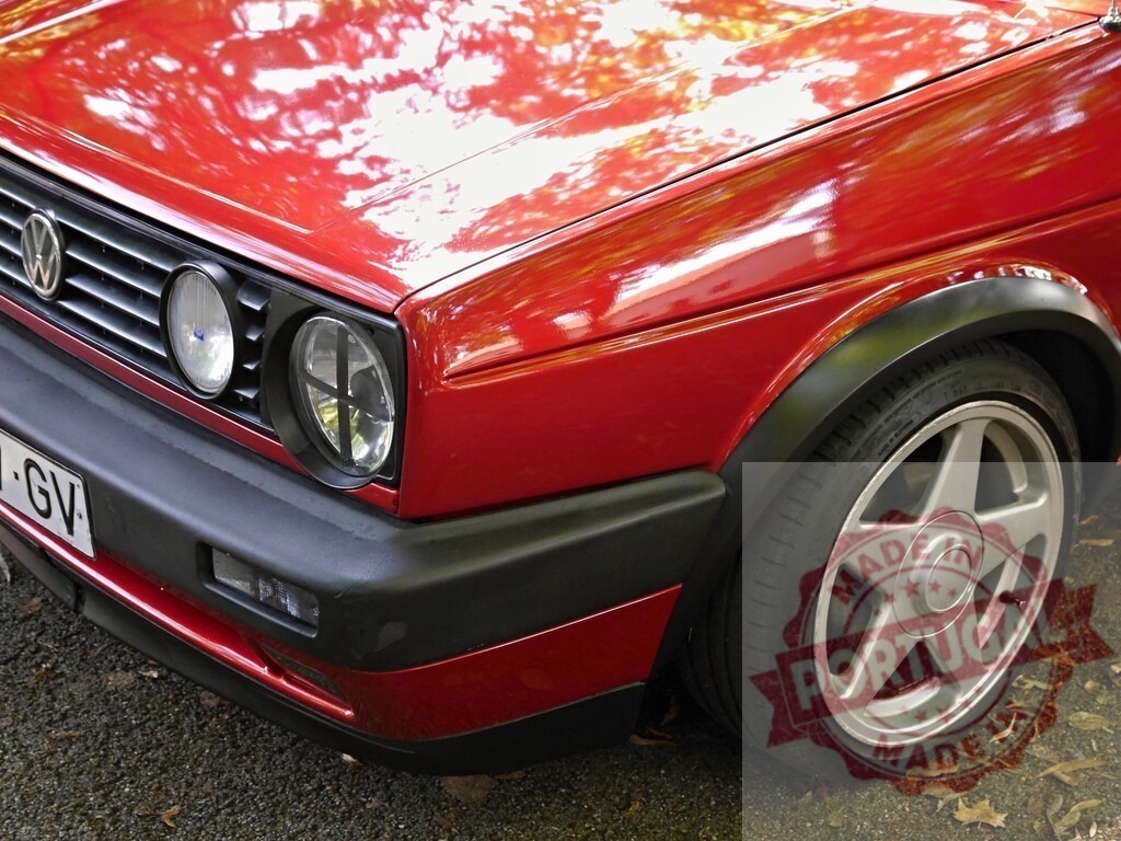 Red Volkswagen Golf GTI mk2 parked outdoors | Red Volkswagen Golf GTI mk2 automobile with custom wheels and a classic design - Realisiert mit Pictrs.com