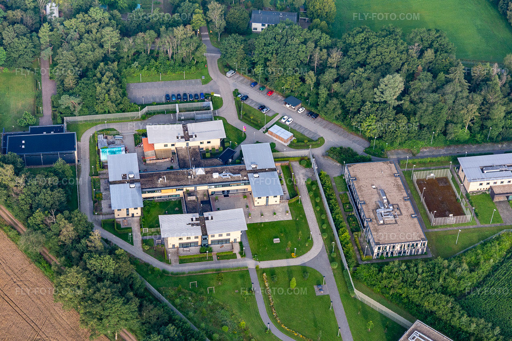 Aerial view: Prison grounds and security fence of the correctional facility. in Rekken in the state Gelderland, Netherlands. – Photo: IMG_008209.jpg taken on 07/18/2020 by Werner Riehm/FLY-FOTO.com – Resolution of the original: 5472 x 3648 px