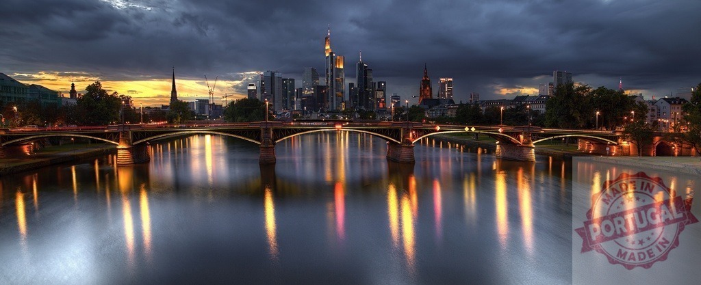 Frankfurt cityscape from Main River at dusk | Frankfurt skyline reflecting Main River lights under dark dramatic clouds - Realized with Pictrs.com