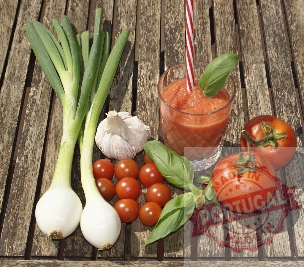 Gazpacho ingredients with fresh tomato soup drink | Fresh vegetables on wooden table creating ingredients for healthy cold tomato soup - Realized with Pictrs.com