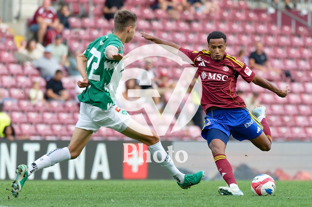 Brack Super League - Servette FC v FC Saint-Gall | Lilian Njoh (14 Servette FC) shoots the ball (action) during the Brack Super League match between Servette FC and FC Saint-Gall at Stade de Geneve in Geneva, Switzerland
