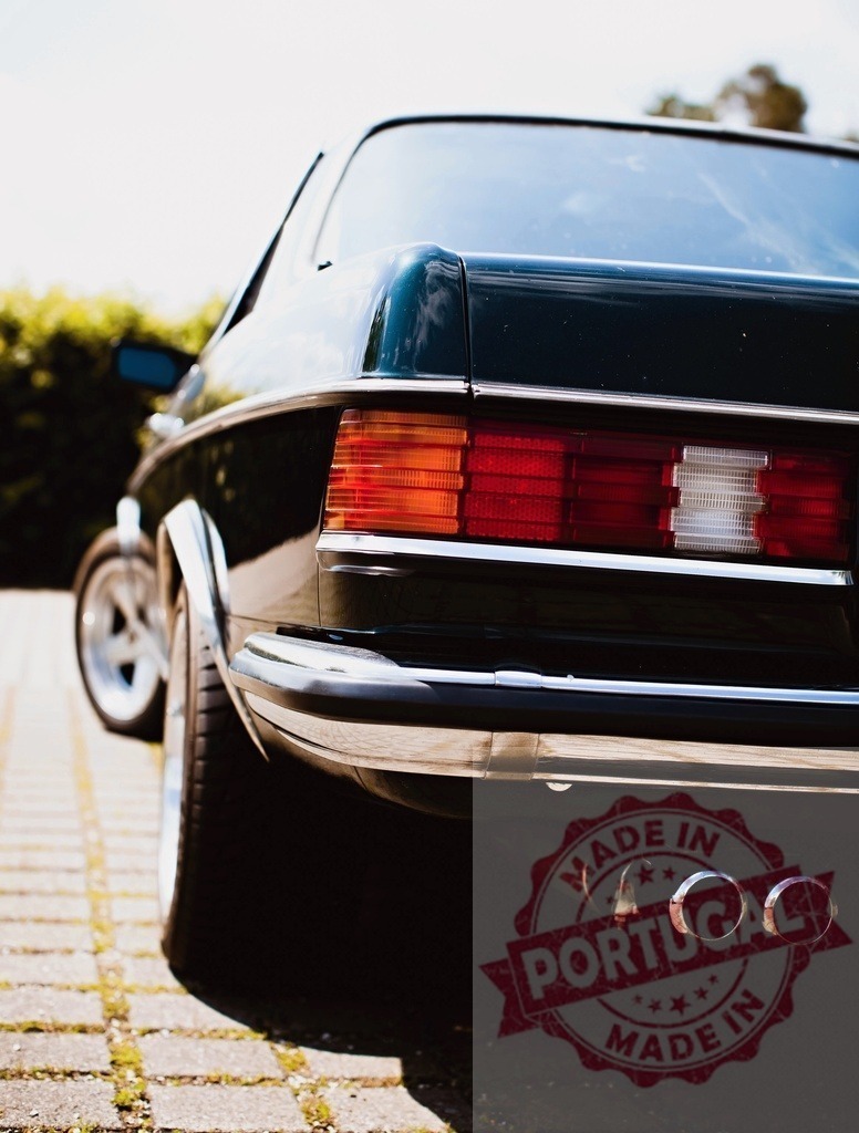 Back view of a parked Mercedes-Benz W123 coupe showing tail lights and exhaust pipes | Classic Mercedes-Benz W123 coupe parked on a paved area, showcasing its tail lights and exhaust pipes - Realized with Pictrs.com