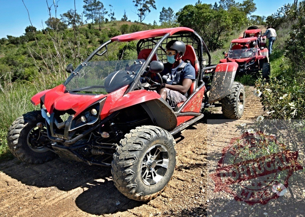 People driving red buggies on off-road trail | People enjoying an outdoor adventure driving red off-road buggies on a dirt track - Realized with Pictrs.com
