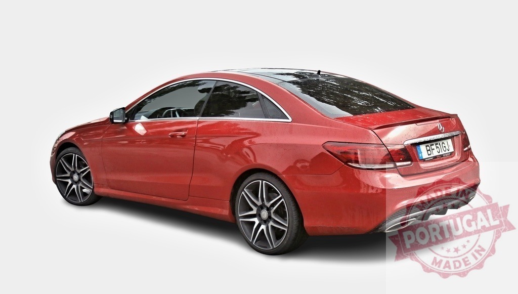 Red Mercedes-Benz E-Class Coupe parked on white background | Shiny red Mercedes-Benz E-Class Coupe parked on a white background, slightly from the back - Realized with Pictrs.com