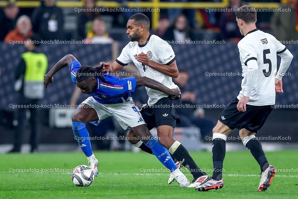 DFB23032501085 | 23.03.2025, Fußball, Viertelfinale UEFA Nations League, Deutschland - Italien, Signal Iduna Park, Saison 2024 2025: Moise Kean (ITA #09) im Zweikampf gegen Jonathan Tah (GER #04) DFB regulations prohibit any use of photographs as image sequences and or quasi-video.