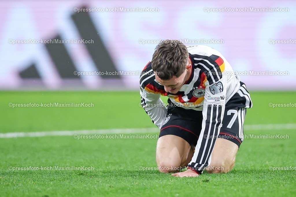 DFB14112501068 | 14.11.2025, Fußball, Länderspiel, WM-Qualifikation Europa, Deutschland - Luxemburg, Stade de Luxembourg (Croix de Gasperich, Luxemburg), 9. Spieltag, Saison 2025 2026: Florian Wirtz (GER #17) liegt mit Schmerzen im Strafraum auf dem Spielfeld  Regulations prohibit any use of photographs as image sequences and or quasi-video.