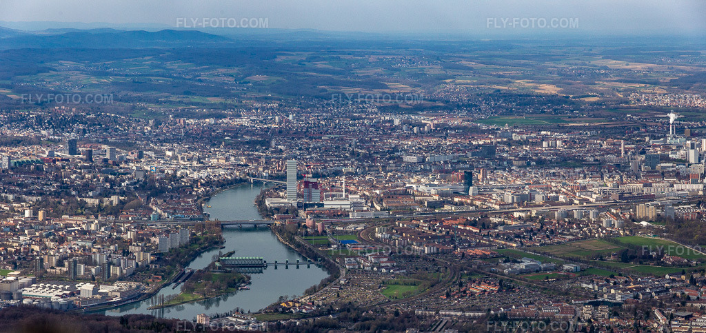 Aerial view: City view on the banks of the High Rhine river in the district Wettstein in Basel in the state Basel city, Switzerland. – Photo: IMG_120216-Pano.jpg taken on 03/17/2020 by Werner Riehm/FLY-FOTO.com – Resolution of the original: 6958 x 3281 px