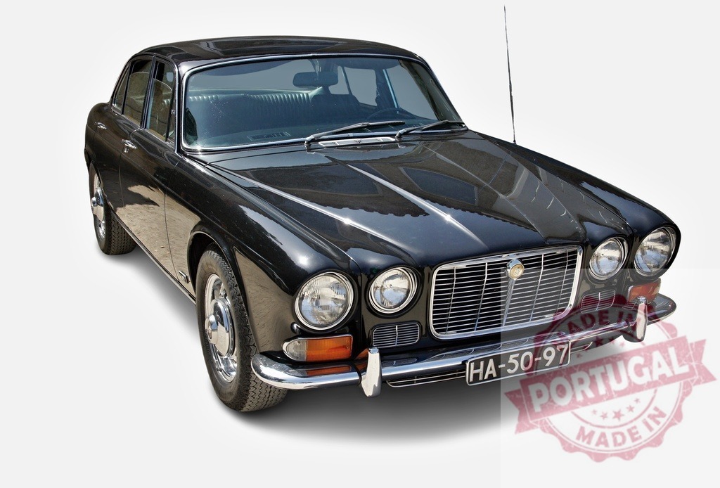 Black Jaguar XJ vintage luxury car isolated | Black Jaguar XJ classic car showcasing vintage style and luxury on a white background - Realized with Pictrs.com