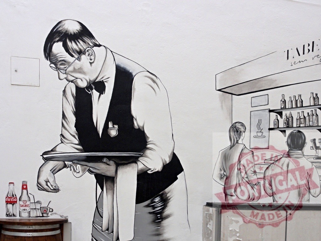 Old waiter mural serving drinks in street art cafe | Street art mural depicting an old waiter serving drinks at a cafe bar with customers - Realized with Pictrs.com