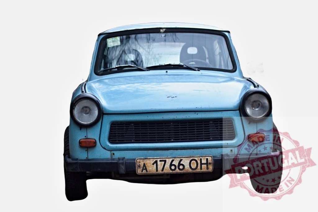 Light blue Trabant 601 facing forward, isolated on white background | Frontal view of a light blue Trabant 601, a classic East German car, isolated on a white background - Realized with Pictrs.com
